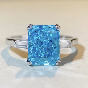 Luxurious S925 silver ring with a large rectangular blue zircon and side stones