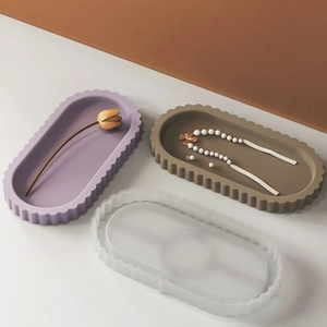 Macro detail of oval wave tray mold with purple and brown resin plaster finished products