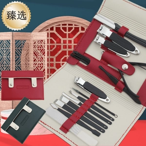 Detail of 16-piece black manicure set with anti-slip steel tools in premium leather case