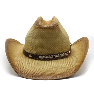 Handwoven straw cowboy hat with vintage brown trim and patterned band on white background