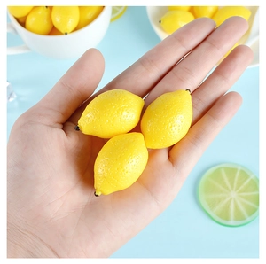 Macro detail of a 2.5cm realistic mini yellow lemon model with fine peel texture