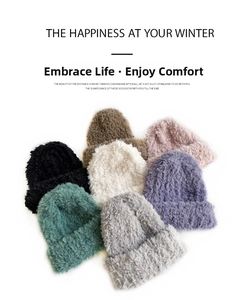 Close-up of soft faux mink fur texture on colorful winter knitted beanies in seven shades