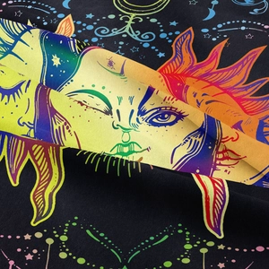 Close-up of bohemian sun and moon tapestry fabric showing detailed twill texture