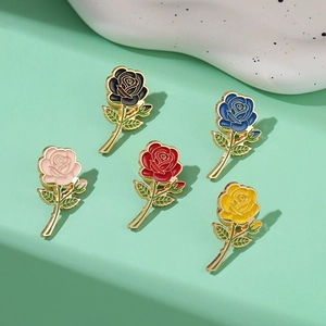 Set of five elegant rose flower brooches in assorted colors with gold metal trim