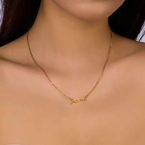 Close-up of a gold Mama script pendant necklace on a model for Mother's Day gift