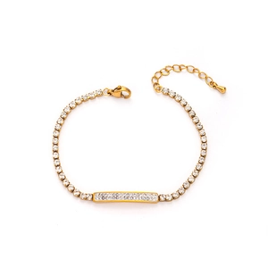 Detail view of a gold-plated bracelet featuring white zircon stones and adjustable lobster clasp