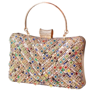 Elegant gold evening bag with colorful crystals and V-shaped geometric rhinestone patterns