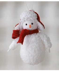 Detail of plush Christmas snowman ornament with red knit hat and scarf hanging on white string