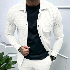Close-up of men's white long-sleeved shirt with detailed diagonal twill texture and pockets