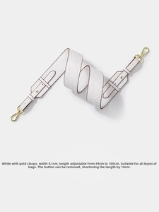 Detail of adjustable white crocodile pattern leather strap with gold lobster clasps