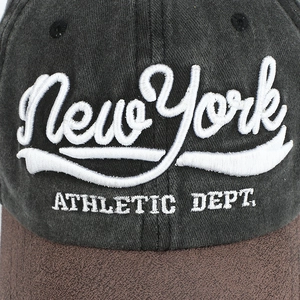 Detail of vintage baseball cap with 3D New York embroidery and two-tone stitching
