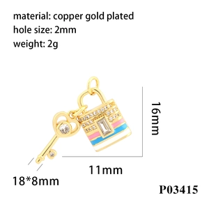 Macro view of 18K gold plated lock and key pendant with colorful zircon stones