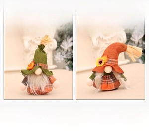 Detail view of two autumn harvest gnomes with sunflowers and berries in a cozy home setting