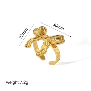 Detail showing dimensions and weight of a golden bow-shaped stainless steel ring