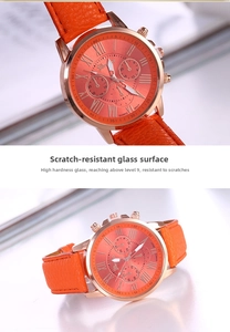 Detail of Geneva watch featuring scratch-resistant glass and orange leather strap