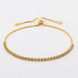 Detail of gold adjustable tennis bracelet with yellow cubic zirconia and slider clasp