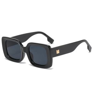 Vintage oversized square sunglasses in glossy black with golden metal rivet details