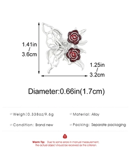 Detail view of silver gothic butterfly earrings with red roses and size dimensions
