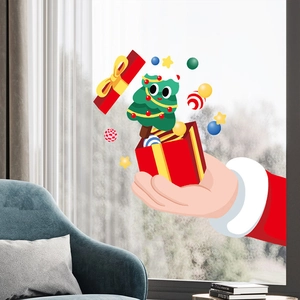 Detailed view of Christmas Santa and tree static window decals on glass for home decor