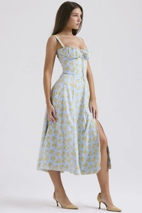 Detailed view of backless floral dress with sexy high side slit and light blue patterns