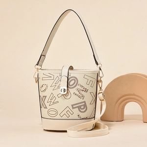 Minimalist beige bucket bag with brown letter print and adjustable shoulder straps