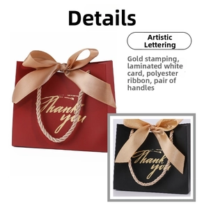 Detail showing the champagne ribbon bow and gold foil Thank You text on wedding gift bags