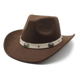 Detail of dark brown wool cowboy hat with wide brim and ornate silver metal concho band