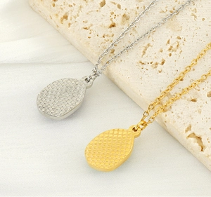 Detailed close-up of water drop pendants with unique honeycomb textured backings