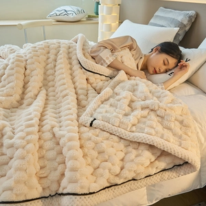 Thick warm milk fleece blanket in cream white with textured spherical embossed design