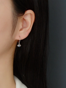 Detailed close-up of S925 sterling silver evil eye hoop earrings with blue zircon