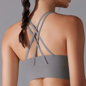 Close-up of grey sports bra with multi-strap criss-cross back design for fitness