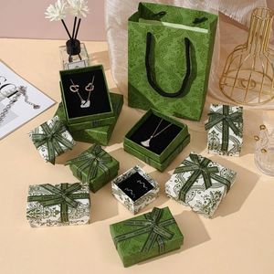 Vintage dark green jewelry gift box set with floral patterns and matching gift bags