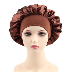Detailed view of brown satin sleep bonnet with high-elastic wide band on head model