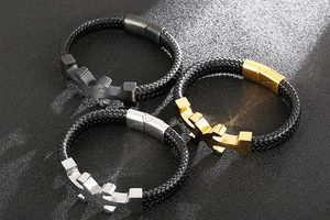 Three men's woven leather bracelets with silver, gold, and black metal magnetic clasps
