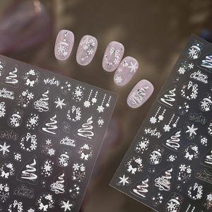 3D embossed Christmas nail stickers with white snowflakes, trees and winter patterns