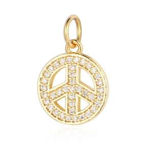 Golden round peace symbol pendant with clear cubic zirconia stones on white background