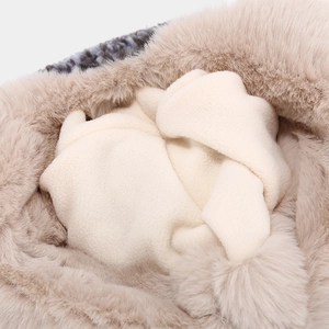 Macro view of thickened faux fur and fleece lining showing soft thermal textures