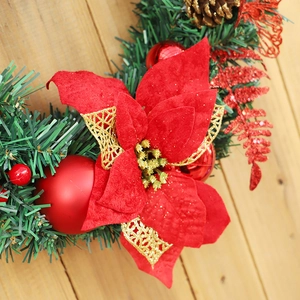 40cm Christmas wreath featuring red poinsettia flowers, pine cones and needles on wood