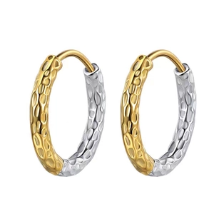 Minimalist two-tone titanium steel hoop earrings with hammered texture and golden accents