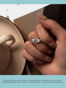 Detail shot of a s925 silver leaf ring on finger, featuring an adjustable open design