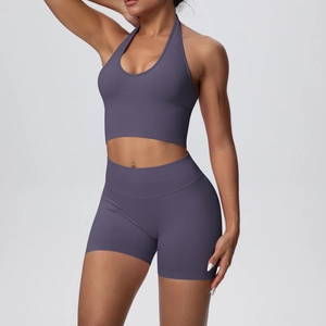 Detail of seamless ribbed high waist sports shorts and halter neck yoga bra in dark grey blue