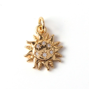 Golden sun-shaped metal pendant with inlaid crystals and star engraving for DIY jewelry