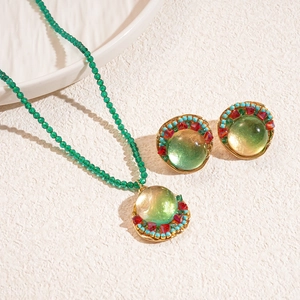 Bohemian jewelry set with green resin beads necklace and matching earrings in gold finish