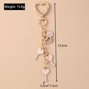 Detail showing pink and white enamel heart charms with dimensions 13.2cm length