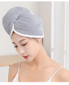 Close-up of grey double-layer microfiber hair towel with white trim on a model