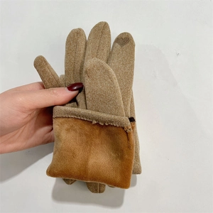 Detail of plush thermal lining and heart-shaped touchscreen fingertip on winter gloves
