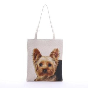 Close-up of realistic Yorkshire Terrier print on minimalist beige canvas tote bag surface