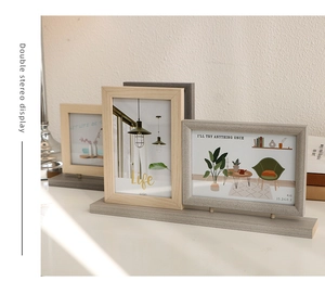 Modern 3-frame vertical photo display on grey wooden base with layered 4x6 frames