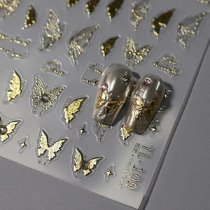 3D gold butterfly nail stickers with star motifs and metallic embossing effects