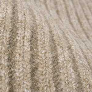 Thick khaki wool knit beanie featuring premium ribbed texture and warm fleece finish
